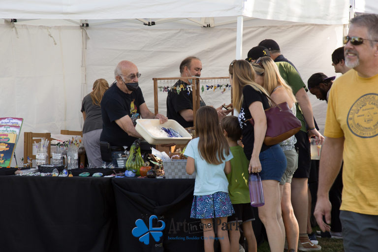 Art in the Park 2021 family looking at glass artwork