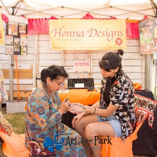 Art in the Park 2021 woman getting henna design on her hand