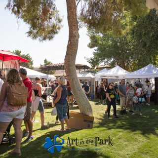 Art in the Park 2021 crowd and tents under trees