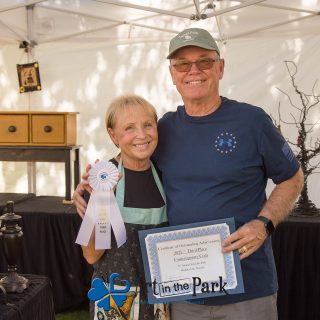 Art in the Park 2021 artist with third place contemporary craft ribbon and certificate