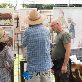 Art in the Park 2021 artist talking to patrons