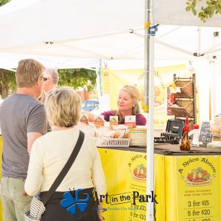 Art in the Park 2021 a spice above vendor with patrons