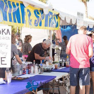 Art in the Park 2021 wine and spirits stand couple ordering drinks