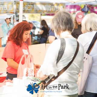 Art in the Park 2021 women buying pies