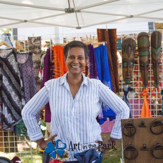 Art in the Park 2021 artist with african style masks and clothing