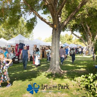 Art in the Park 2021 crowd and booths under trees