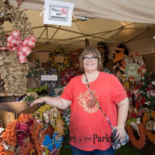 Art in the Park 2021 artist with wreaths